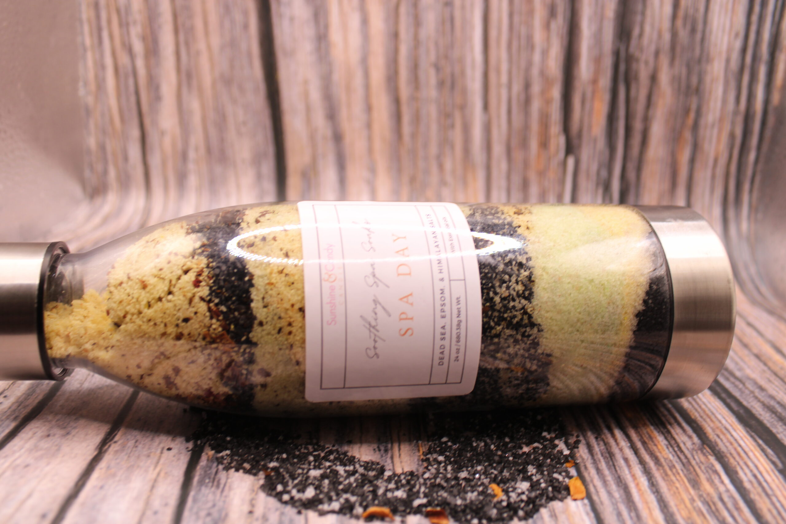 IMG_5038 Glass jar of Soothing Spa Salts with visible rose petals, pink and black salt crystals—perfect for muscle relief and a luxury spa day at home.